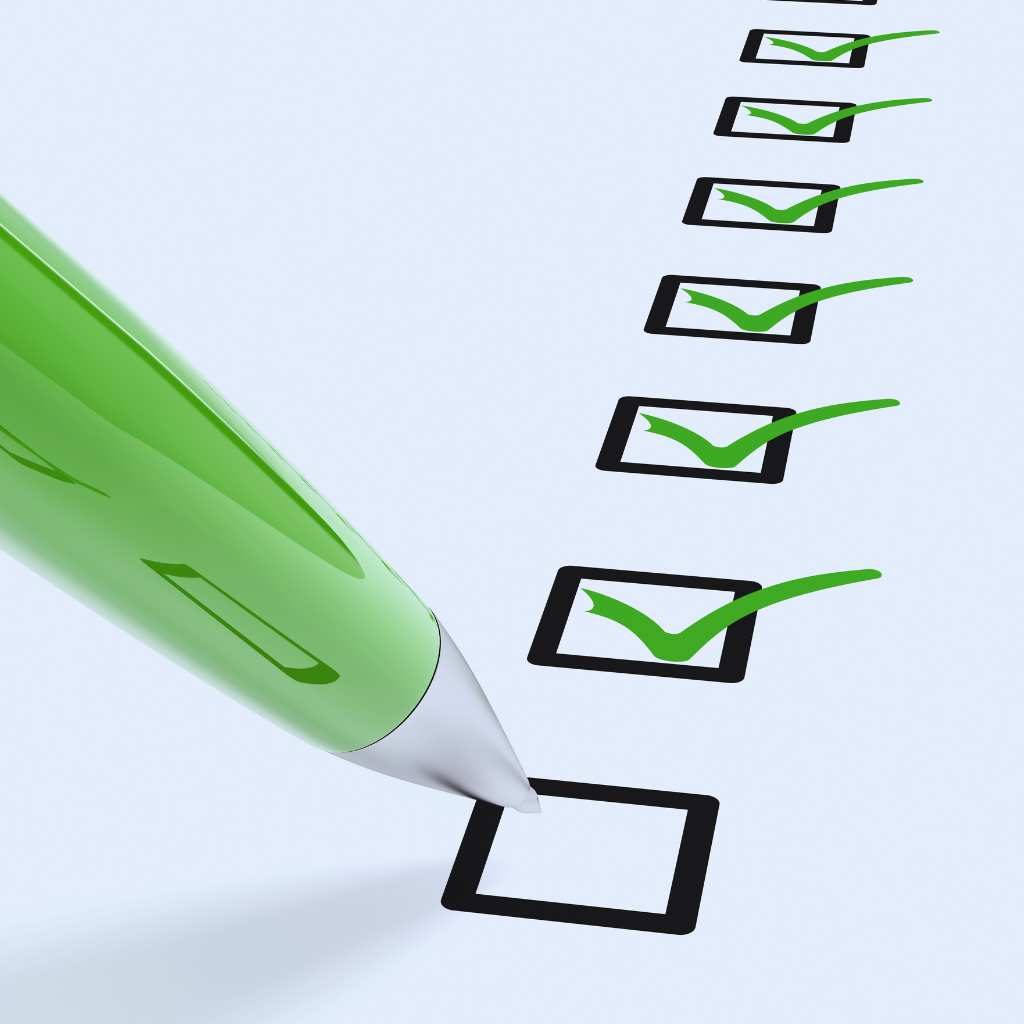 Green pen checking boxes on a digital accessibility compliance checklist